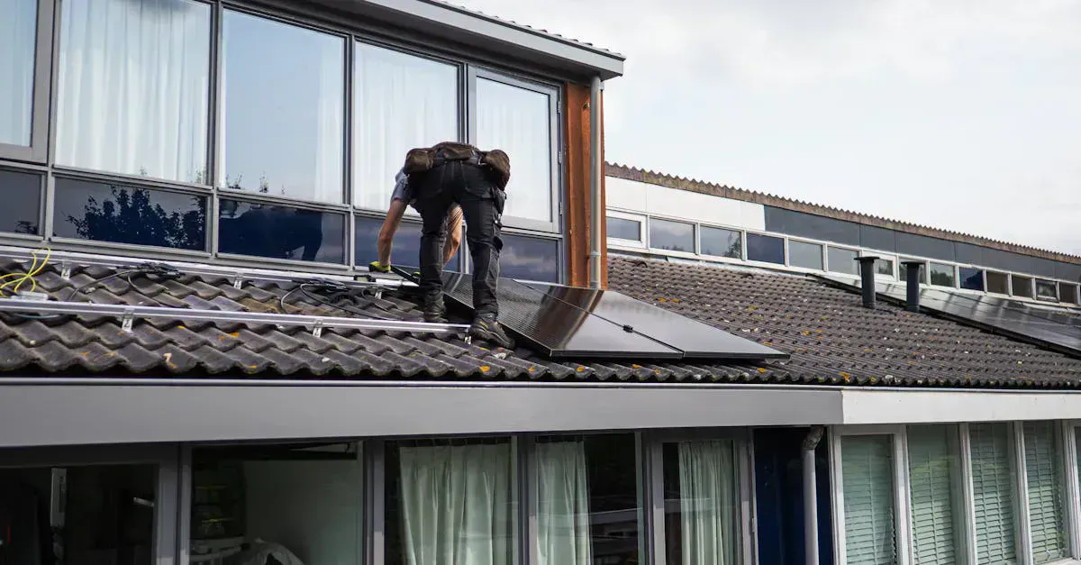 Technician installing solar panels on a roof