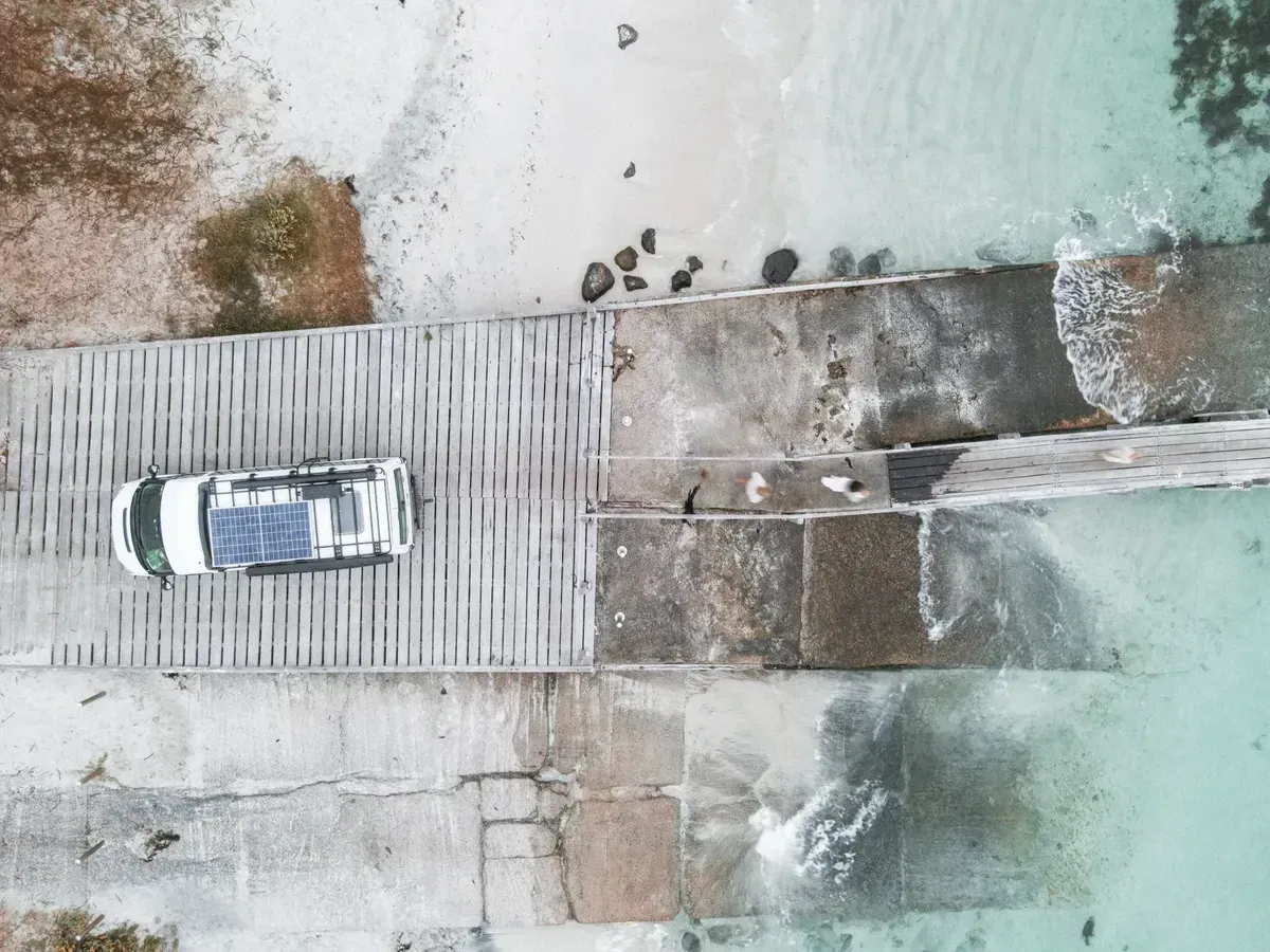 Solar panels on an RV roof feeding a portable power station for off-grid travel